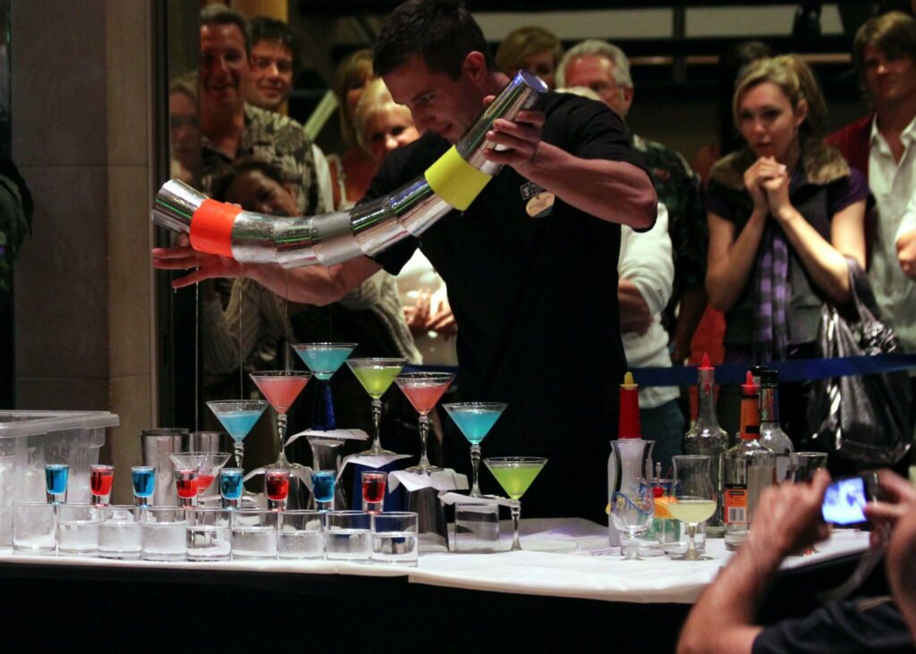 flair bartender performing infront of guests